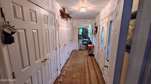 177 Crane Rd, Lakeville, PA 18438 - corridor featuring dark tile patterned flooring and inlaid floor details