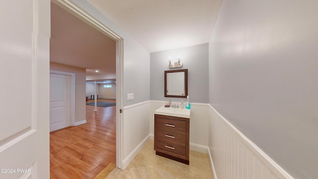 bathroom with hardwood / wood-style floors and vanity