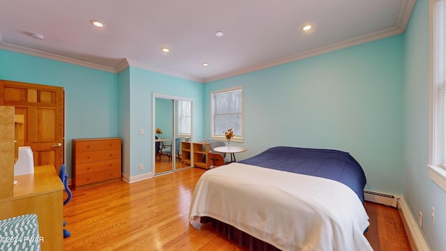 bedroom featuring light wood-type flooring, multiple windows, and ornamental molding