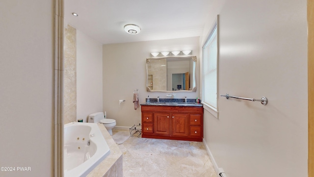 bathroom with tiled bath, vanity, and toilet