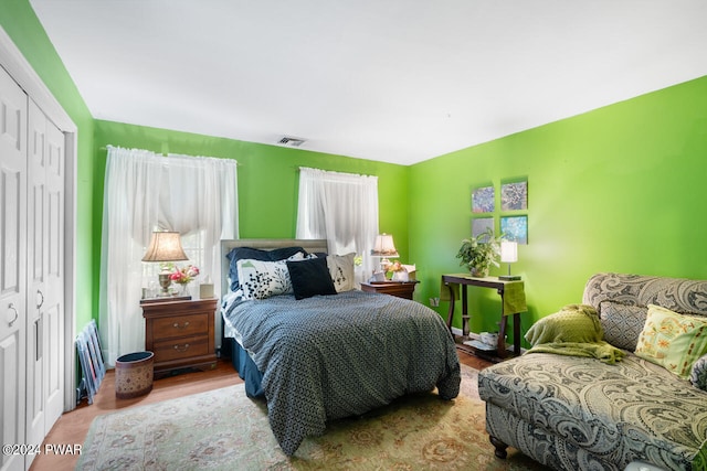 bedroom featuring a closet and hardwood / wood-style flooring