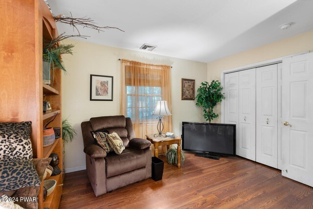 living area featuring dark hardwood / wood-style floors