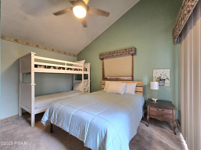 carpeted bedroom with lofted ceiling and ceiling fan