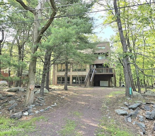 6128 Wales Ct, East Stroudsburg, PA 18301 - view of front of home featuring stairway and dirt driveway