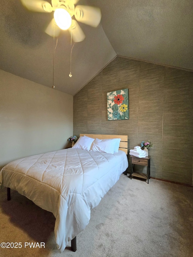 bedroom with carpet, vaulted ceiling, and ceiling fan