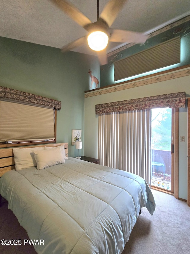 carpeted bedroom featuring ceiling fan and access to outside