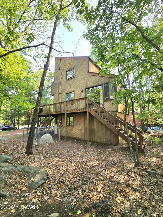 6128 Wales Ct, East Stroudsburg, PA 18301 - back of house with stairway and a wooden deck