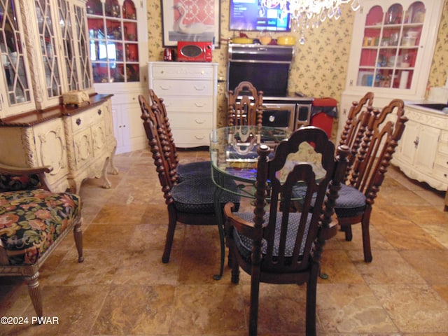 dining area featuring a notable chandelier