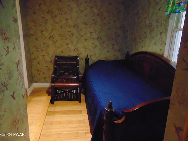 bedroom featuring wood-type flooring