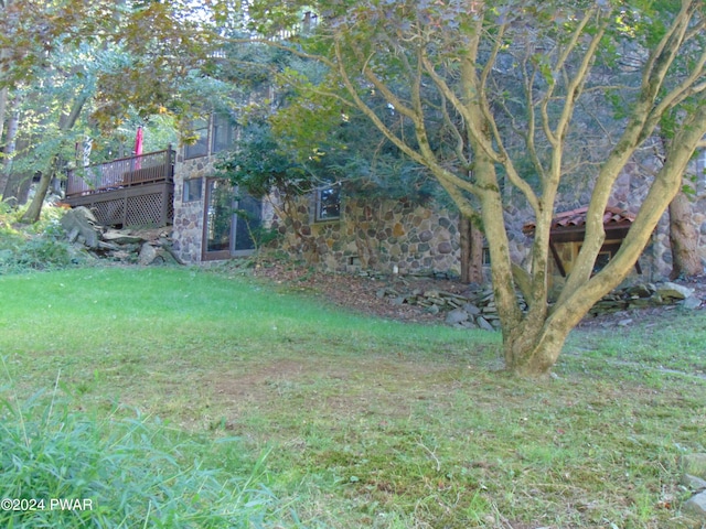 view of yard with a wooden deck