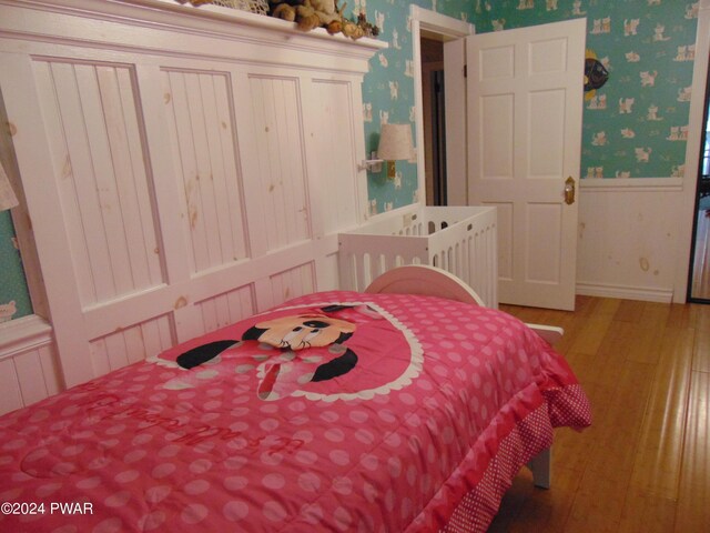 bedroom with wood-type flooring