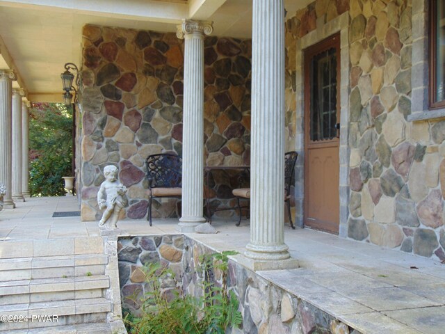 exterior space featuring ornate columns