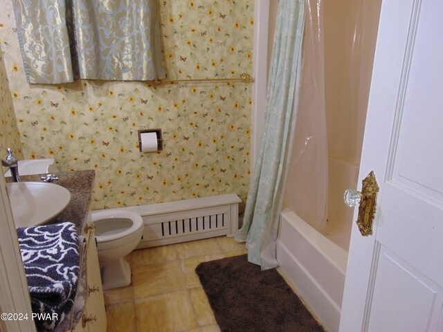 full bathroom featuring tile patterned flooring, shower / bath combination with curtain, vanity, and toilet