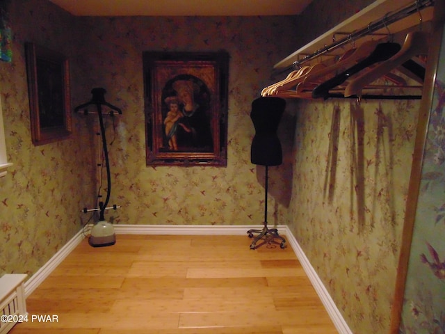 laundry area with hardwood / wood-style floors