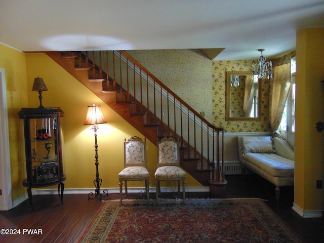 interior space with hardwood / wood-style floors and an inviting chandelier