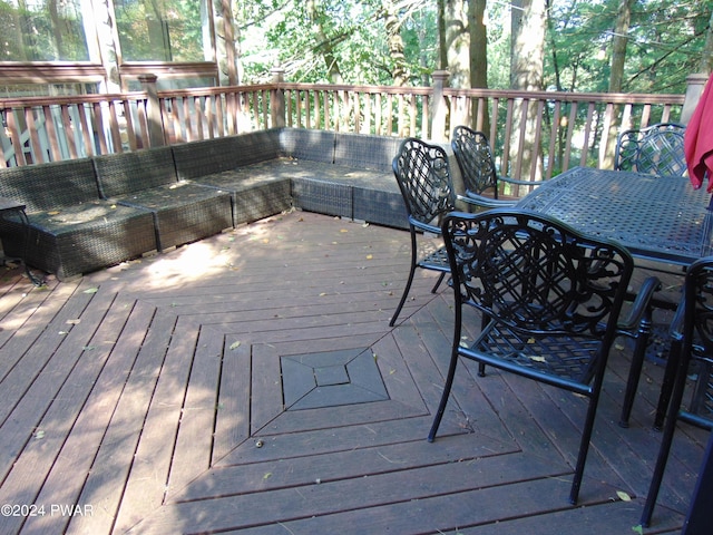 wooden terrace featuring outdoor lounge area