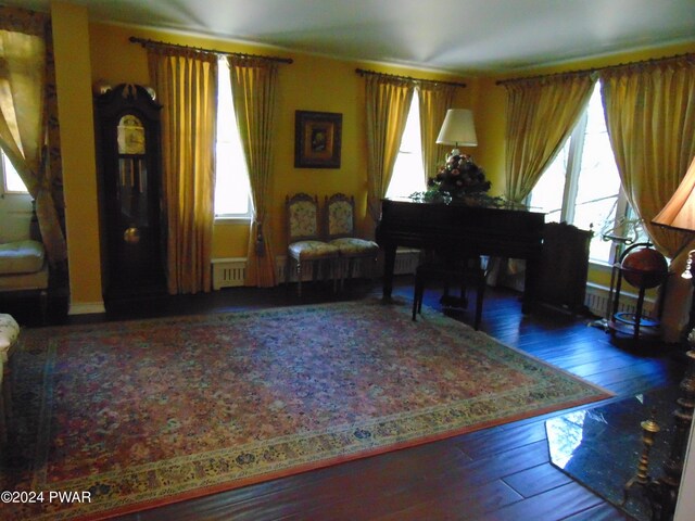 living area with hardwood / wood-style flooring