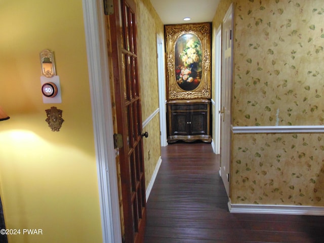 corridor with dark hardwood / wood-style floors