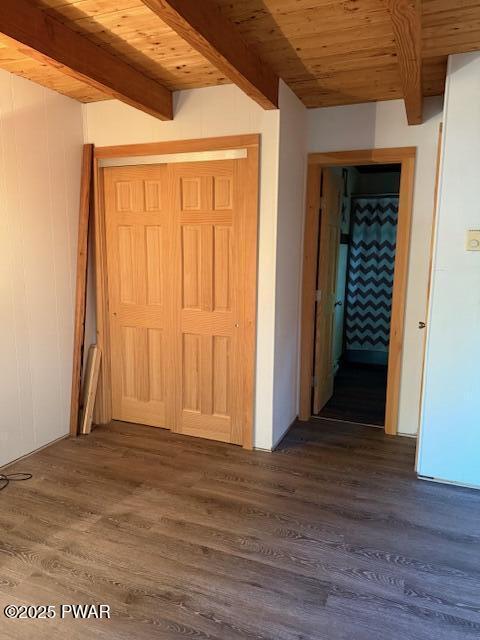 1030 Evergreen Dr, Lake Ariel, PA 18436 - corridor with wood ceiling with exposed beams and dark wood-style flooring
