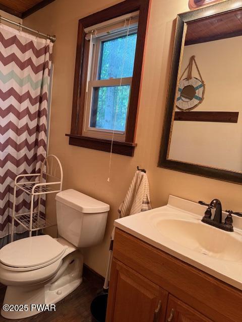 1030 Evergreen Dr, Lake Ariel, PA 18436 - full bath featuring vanity, toilet, curtained shower, and wood finished floors