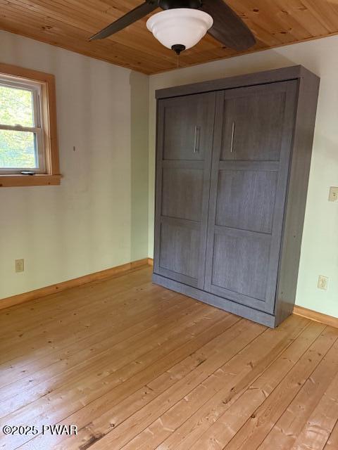 1030 Evergreen Dr, Lake Ariel, PA 18436 - unfurnished bedroom with light wood-type flooring, wooden ceiling, baseboards, and ceiling fan