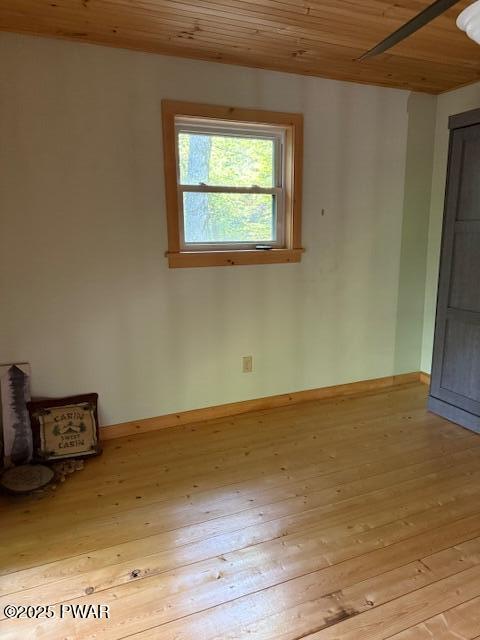 1030 Evergreen Dr, Lake Ariel, PA 18436 - unfurnished room with wood ceiling, light wood-type flooring, and baseboards