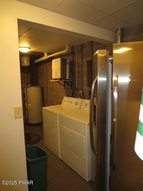 1030 Evergreen Dr, Lake Ariel, PA 18436 - laundry room with electric water heater, washing machine and clothes dryer, and concrete block wall