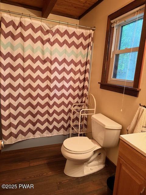 1030 Evergreen Dr, Lake Ariel, PA 18436 - bathroom with vanity, wood ceiling with exposed beams, toilet, hardwood / wood-style flooring, and baseboards