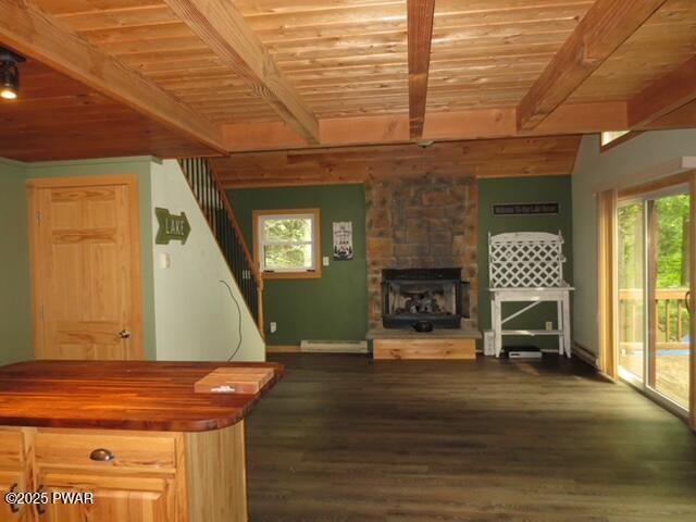 1030 Evergreen Dr, Lake Ariel, PA 18436 - living area with wooden ceiling with exposed beams, stairway, a baseboard radiator, dark wood-style floors, and a fireplace