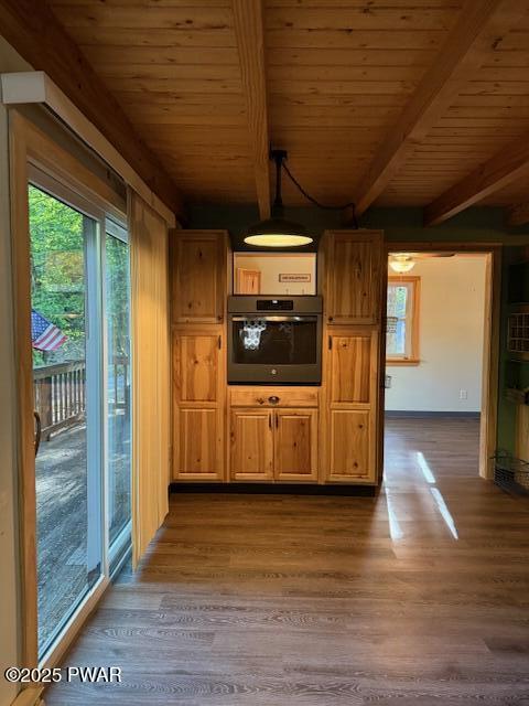1030 Evergreen Dr, Lake Ariel, PA 18436 - kitchen featuring oven, wooden ceiling with exposed beams, healthy amount of natural light, and dark wood-style floors