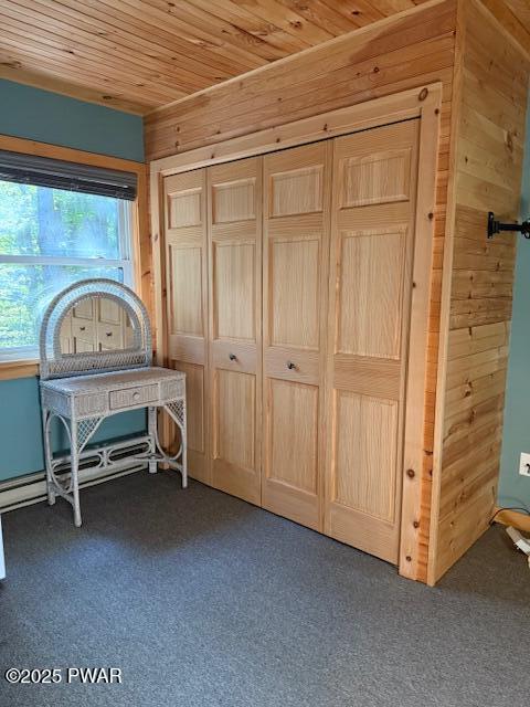 1030 Evergreen Dr, Lake Ariel, PA 18436 - unfurnished bedroom featuring wooden walls, carpet flooring, wooden ceiling, and a closet