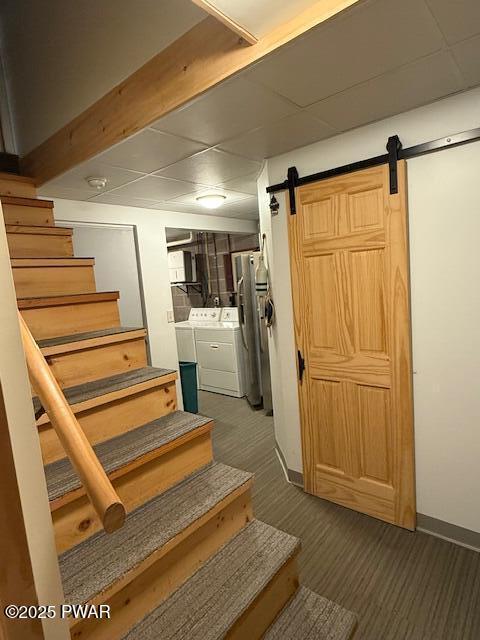1030 Evergreen Dr, Lake Ariel, PA 18436 - staircase with separate washer and dryer, a barn door, carpet, and baseboards