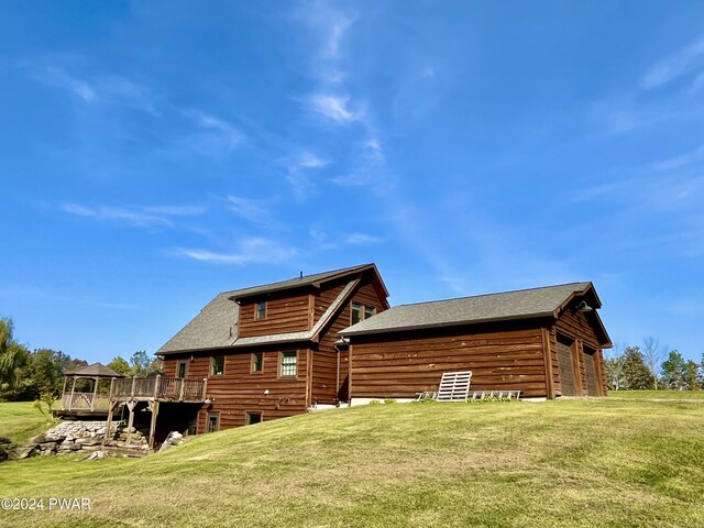 back of property featuring a yard