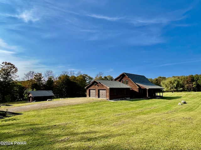 view of home's exterior featuring a garage and a yard