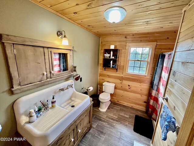 bathroom featuring walk in shower, wood walls, wood ceiling, and toilet