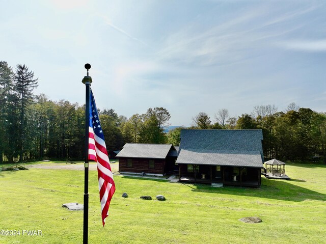 surrounding community featuring a gazebo and a yard