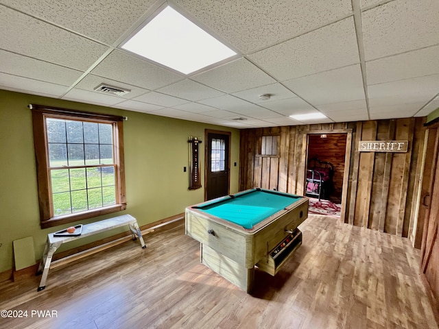 rec room featuring a paneled ceiling, wood walls, light hardwood / wood-style floors, and billiards