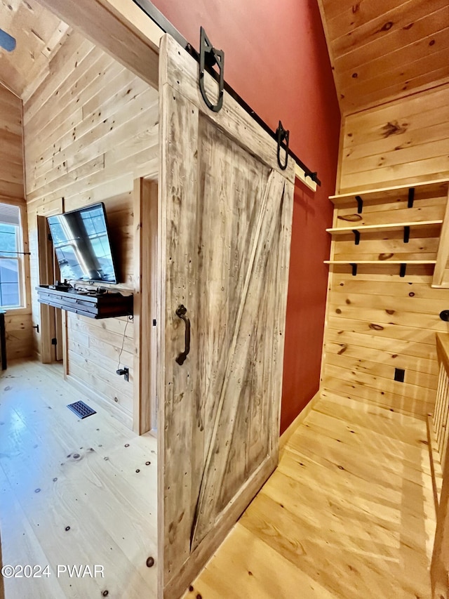 interior space featuring hardwood / wood-style flooring and wood walls