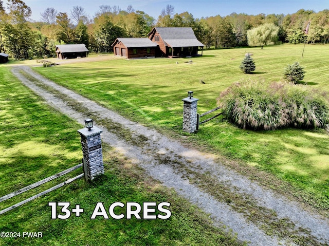 view of yard featuring an outbuilding and a rural view