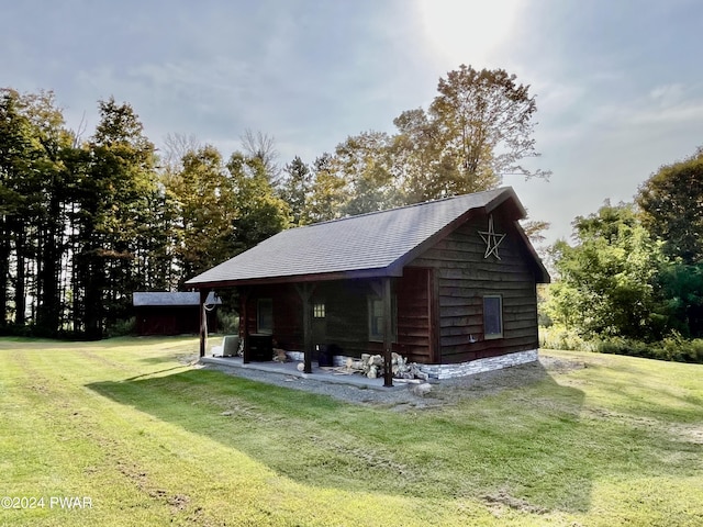 rear view of property with a lawn