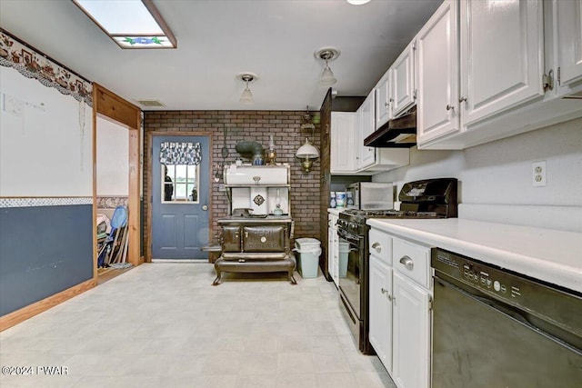 kitchen with brick wall, gas range, white cabinets, black dishwasher, and hanging light fixtures