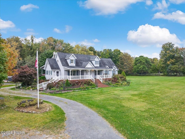 cape cod house with covered porch and a front yard