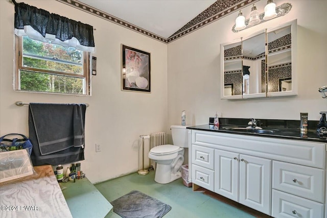 bathroom featuring radiator heating unit, vanity, and toilet