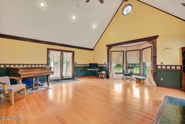 miscellaneous room featuring wood-type flooring, ceiling fan, and lofted ceiling