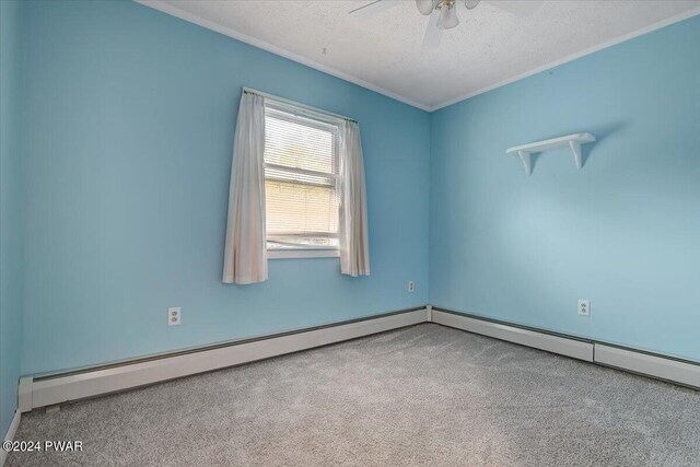 unfurnished room with carpet, a textured ceiling, and a baseboard radiator