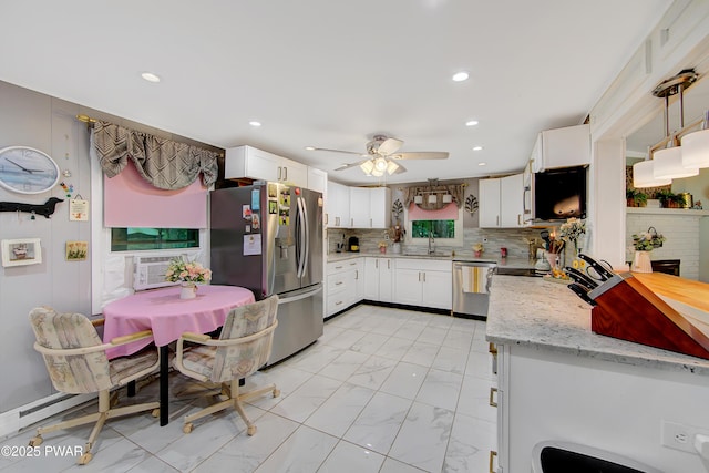 202 Fox Rd, Dingmans Ferry, PA 18328 - kitchen with appliances with stainless steel finishes, light marble finish flooring, white cabinetry, ceiling fan, and recessed lighting