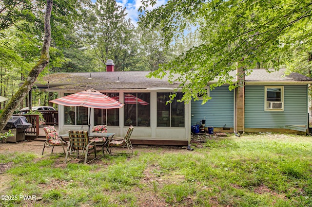 202 Fox Rd, Dingmans Ferry, PA 18328 - rear view of house with a shingled roof and a sunroom
