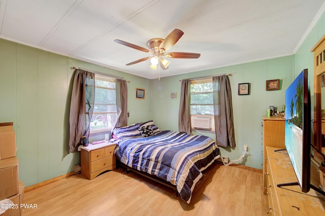 202 Fox Rd, Dingmans Ferry, PA 18328 - bedroom with light wood finished floors, multiple windows, ceiling fan, a decorative wall, and crown molding