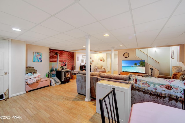 202 Fox Rd, Dingmans Ferry, PA 18328 - living area with a wood stove, a paneled ceiling, light wood-style flooring, and recessed lighting
