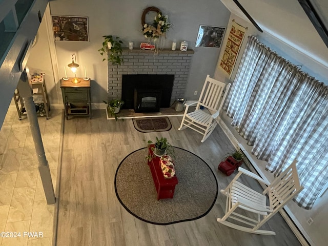 living room featuring hardwood / wood-style flooring and a fireplace